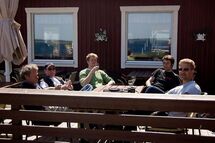 People drinking at a restaurant. Photo. 